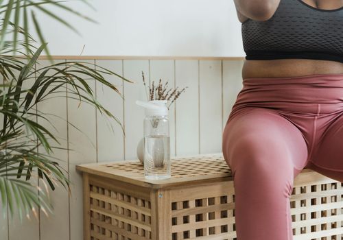 Close-up of comfortable sportswear and sneakers for home workout.